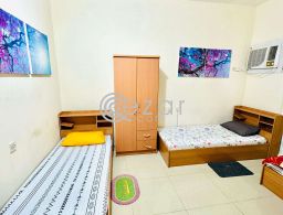 Sharing room bed space near sana signal , bank street , souk waqif , national museum for rent in Qatar