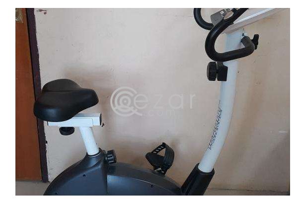 Stationary bike, just 4 month olds - Moving sale photo 1